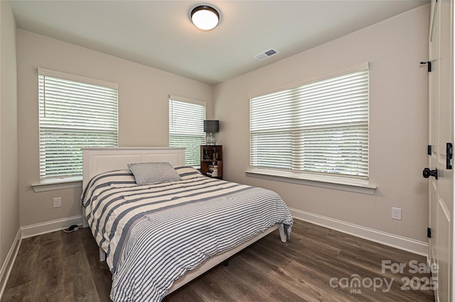 bedroom featuring dark hardwood / wood-style floors