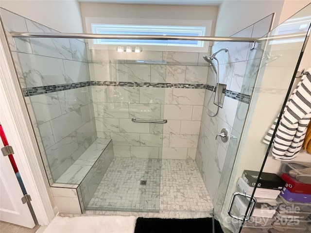 bathroom with a shower with shower door