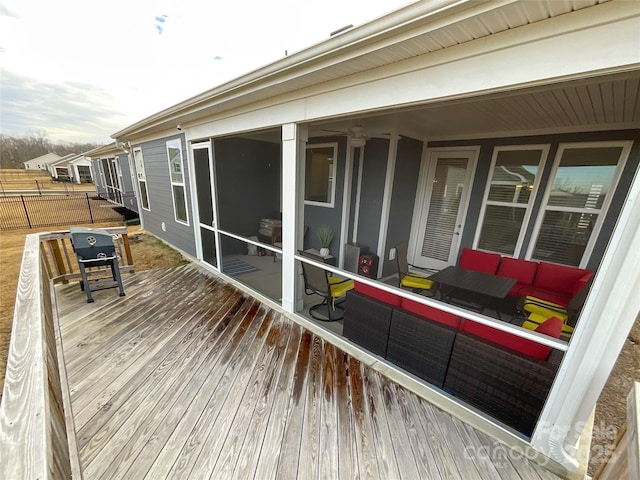 wooden terrace with outdoor lounge area