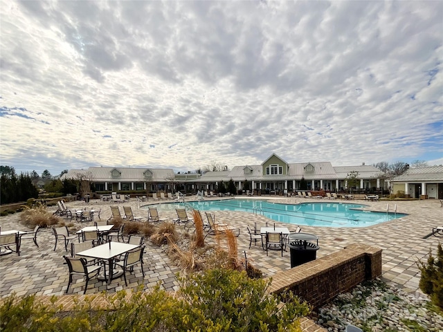 view of swimming pool with a patio area