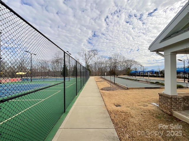 surrounding community with tennis court