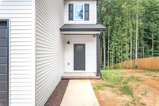 entrance to property featuring a yard