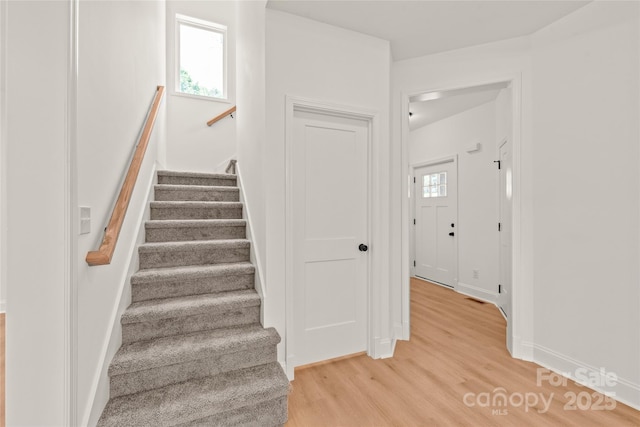 staircase featuring hardwood / wood-style floors