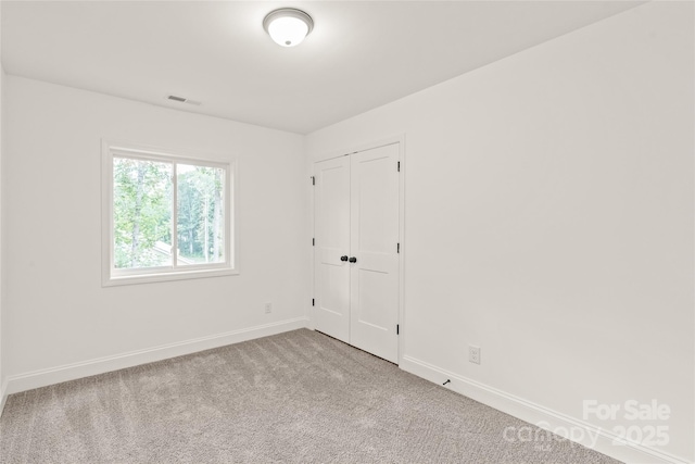 empty room featuring carpet floors