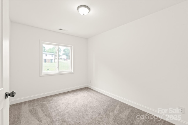 unfurnished room featuring carpet flooring