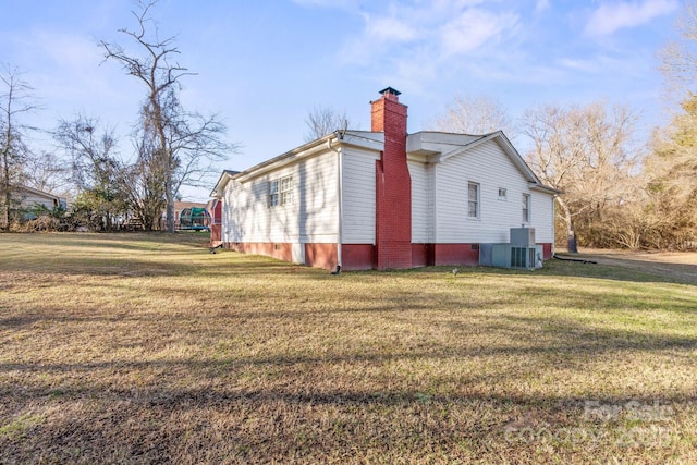 view of home's exterior featuring a yard and central air condition unit