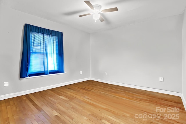 unfurnished room featuring ceiling fan and hardwood / wood-style floors