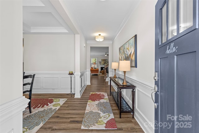 entrance foyer featuring crown molding, ceiling fan, and dark hardwood / wood-style floors