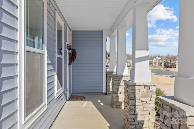 entrance to property featuring covered porch