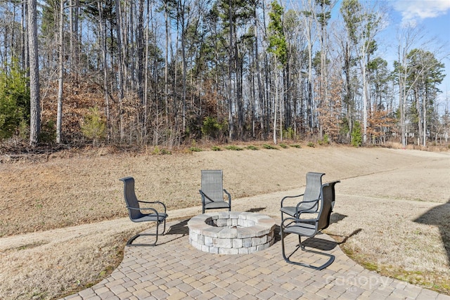 view of patio / terrace with a fire pit