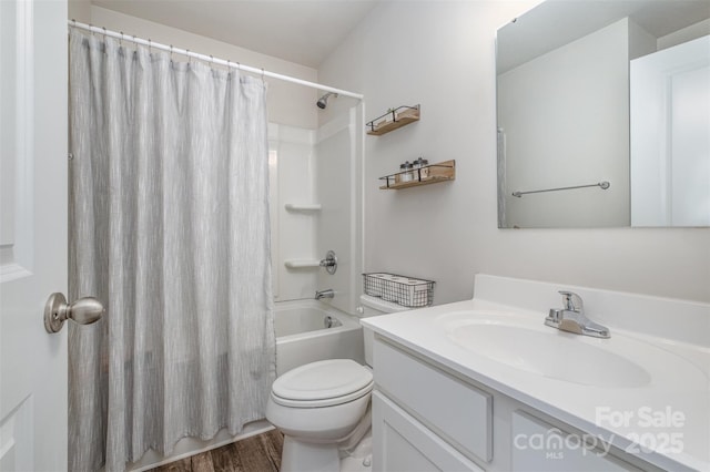 full bathroom with hardwood / wood-style flooring, vanity, shower / bath combo, and toilet