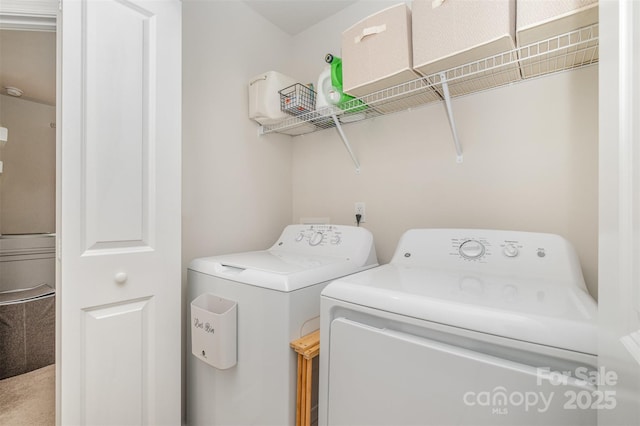 clothes washing area featuring washing machine and dryer