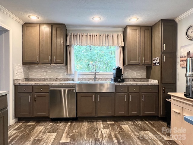 kitchen featuring sink, stainless steel dishwasher, crown molding, a textured ceiling, and decorative backsplash