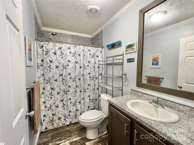 bathroom with crown molding, wood-type flooring, and a textured ceiling