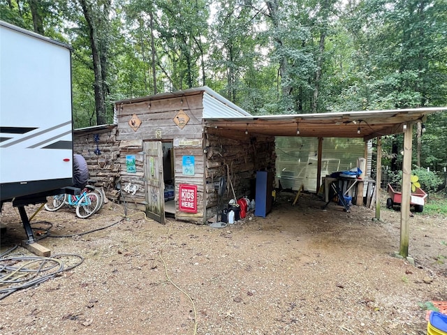 exterior space featuring a carport