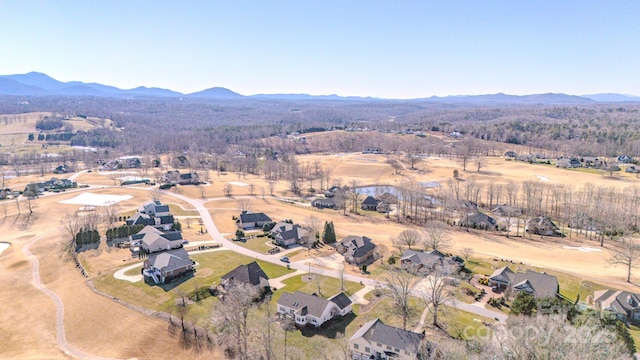 birds eye view of property featuring a mountain view