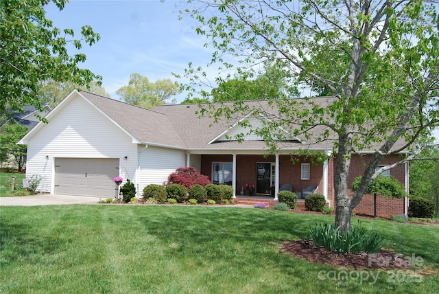 ranch-style home with a garage, a porch, a front yard, and concrete driveway