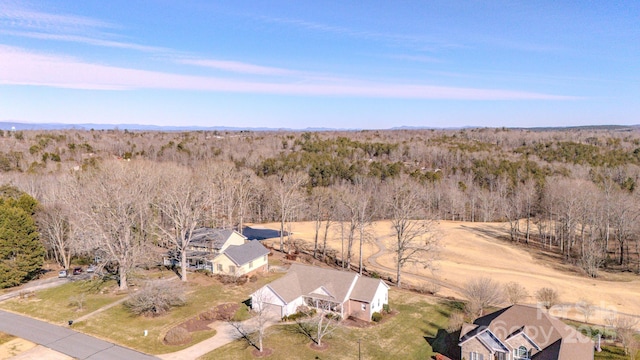 bird's eye view featuring a rural view and a wooded view