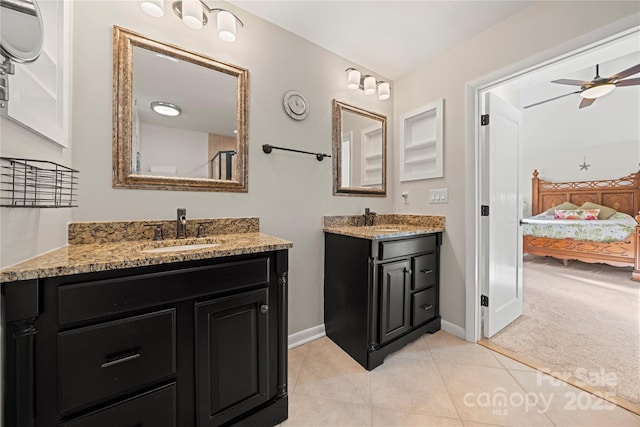 bathroom with ceiling fan, tile patterned floors, and vanity