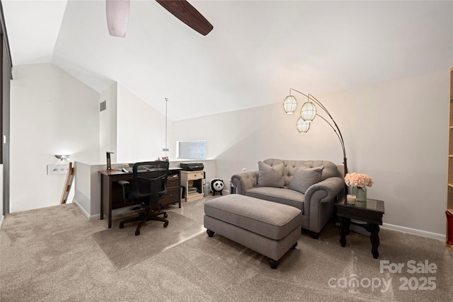 carpeted living room with ceiling fan and vaulted ceiling