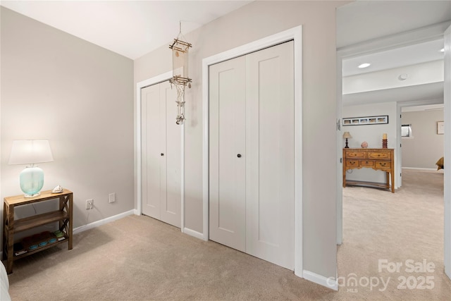 bedroom featuring light carpet