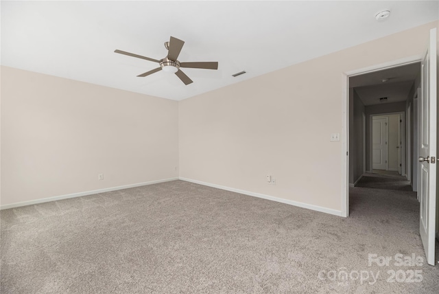 spare room with light colored carpet and ceiling fan