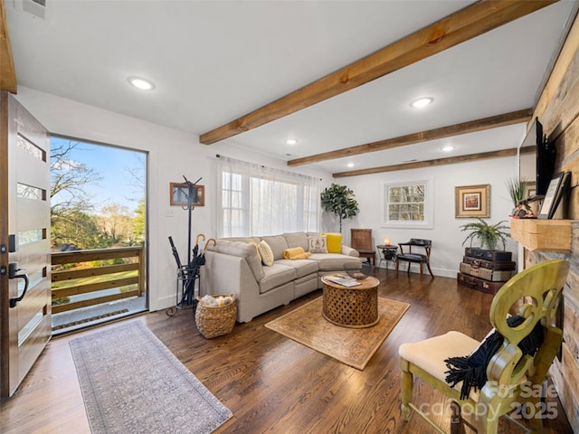 living room featuring beam ceiling and dark hardwood / wood-style flooring