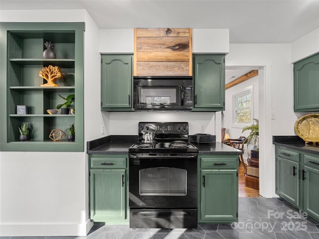 kitchen with black appliances and green cabinetry