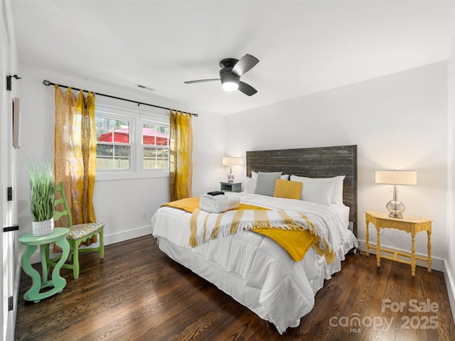 bedroom featuring ceiling fan and dark hardwood / wood-style floors