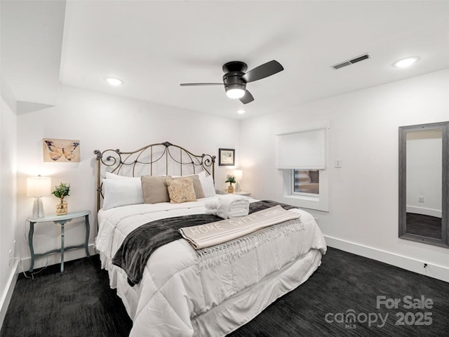 bedroom featuring ceiling fan and dark colored carpet