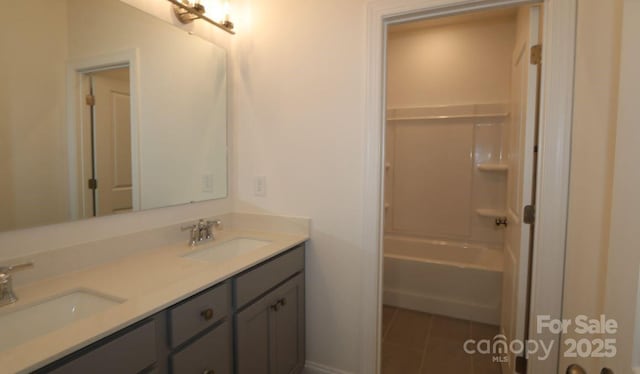 1136 Yellow Springs Dr, Huntersville, NC 28078 - bathroom featuring tile patterned floors, washtub / shower combination, double vanity, and a sink