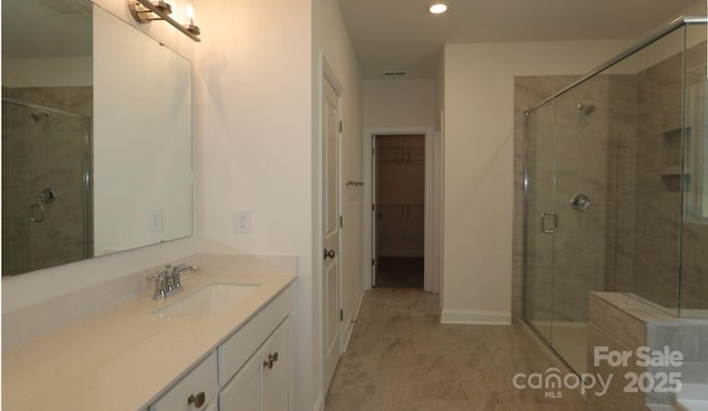 1136 Yellow Springs Dr, Huntersville, NC 28078 - bathroom with recessed lighting, a shower stall, vanity, a walk in closet, and visible vents