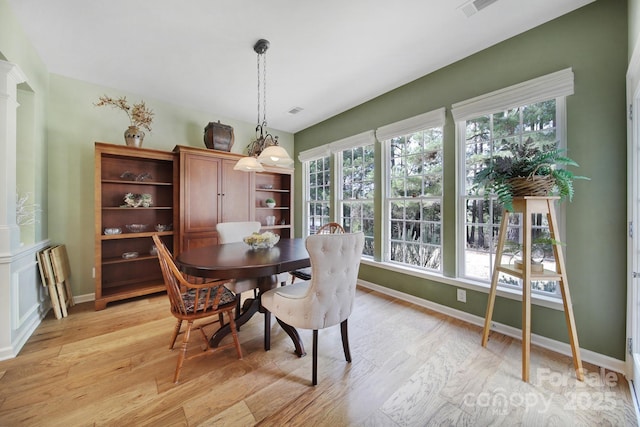 dining area with light hardwood / wood-style floors