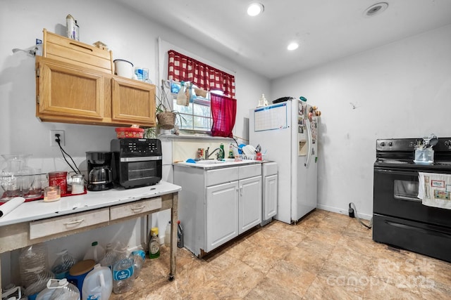 kitchen with electric range, white fridge with ice dispenser, and sink