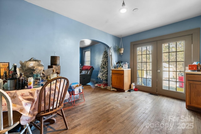 dining area featuring light hardwood / wood-style floors and french doors