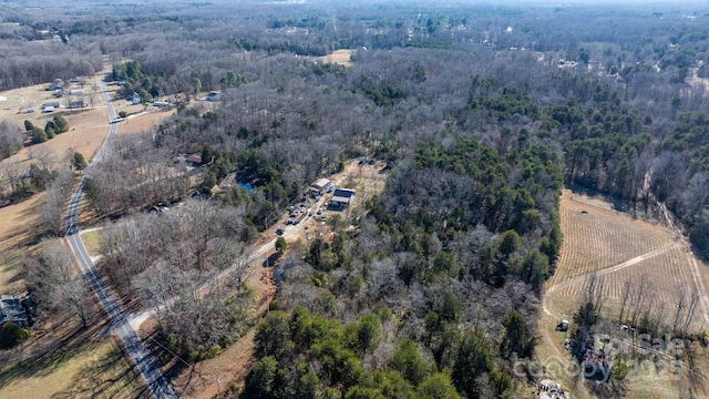 birds eye view of property with a rural view