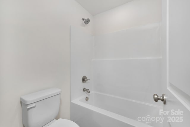 bathroom featuring toilet and shower / tub combination