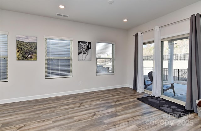 unfurnished room featuring hardwood / wood-style floors