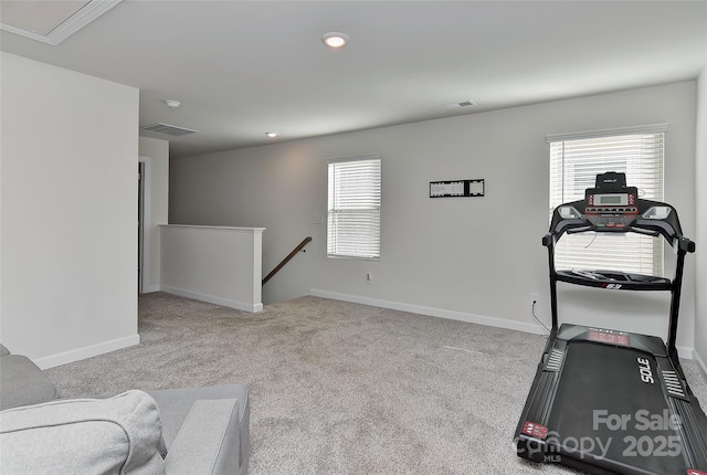 workout room with light colored carpet