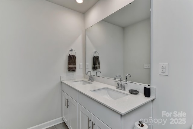 bathroom with vanity and tile patterned floors