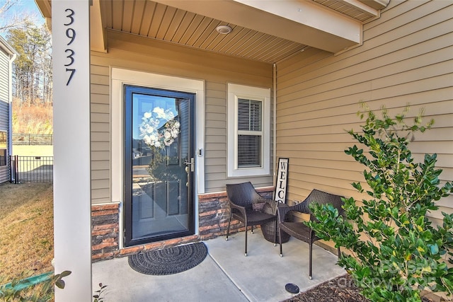 property entrance with a patio area