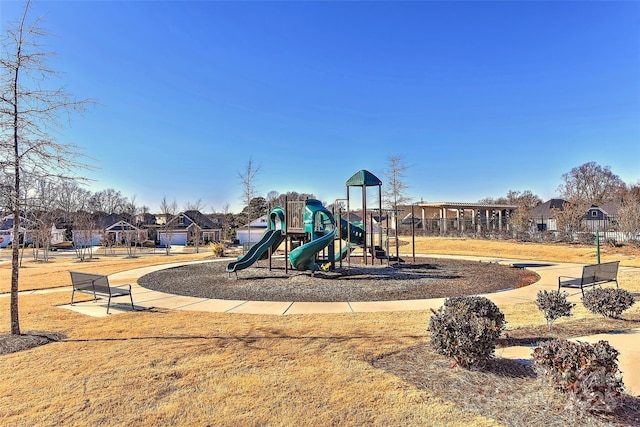 view of playground with a lawn