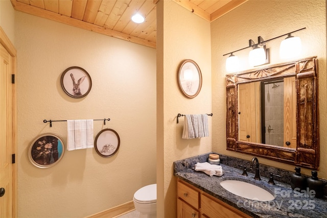 bathroom with vanity, toilet, and wood ceiling