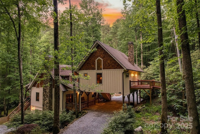 exterior space featuring a carport and a wooden deck