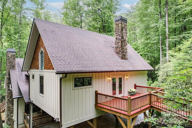 back of property with french doors and a wooden deck