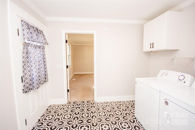 clothes washing area featuring cabinets, ornamental molding, and washing machine and dryer