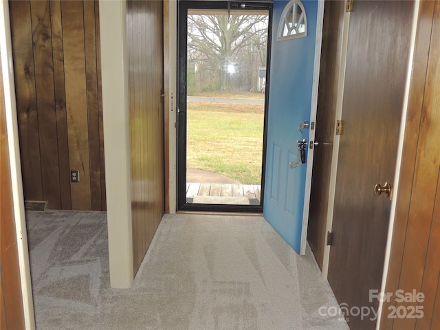 entryway with carpet and plenty of natural light