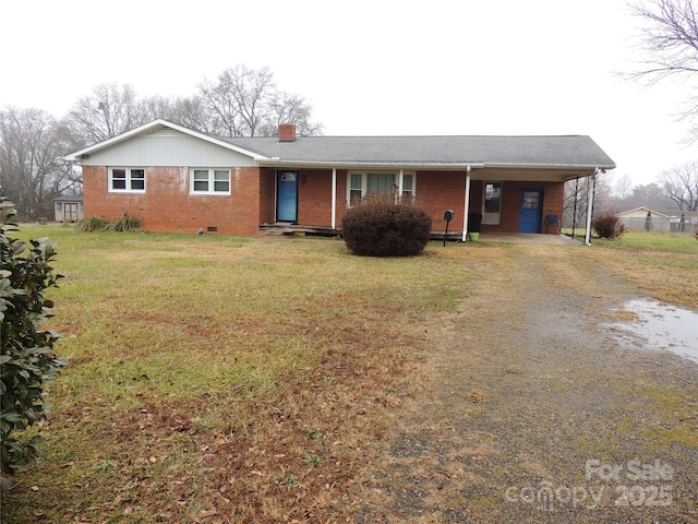 ranch-style home with a front lawn and a carport