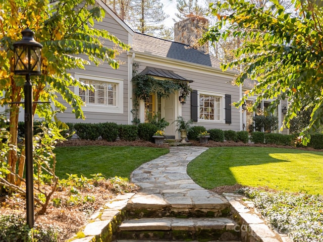 view of front of home with a front yard