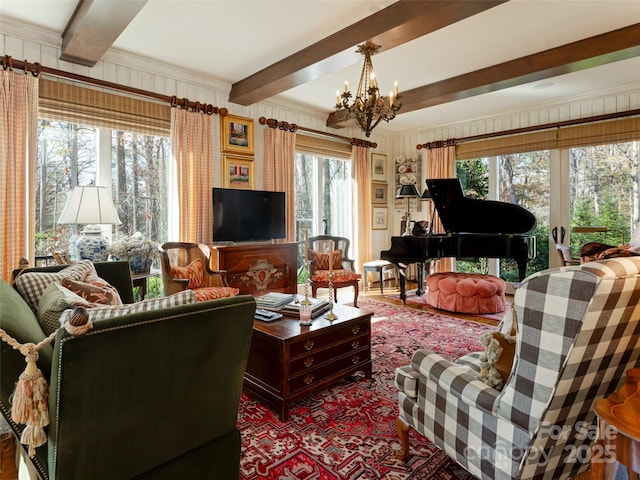 living room featuring beamed ceiling and a chandelier